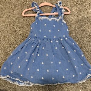 Blue Sleeveless Dress with White Floral Pattern